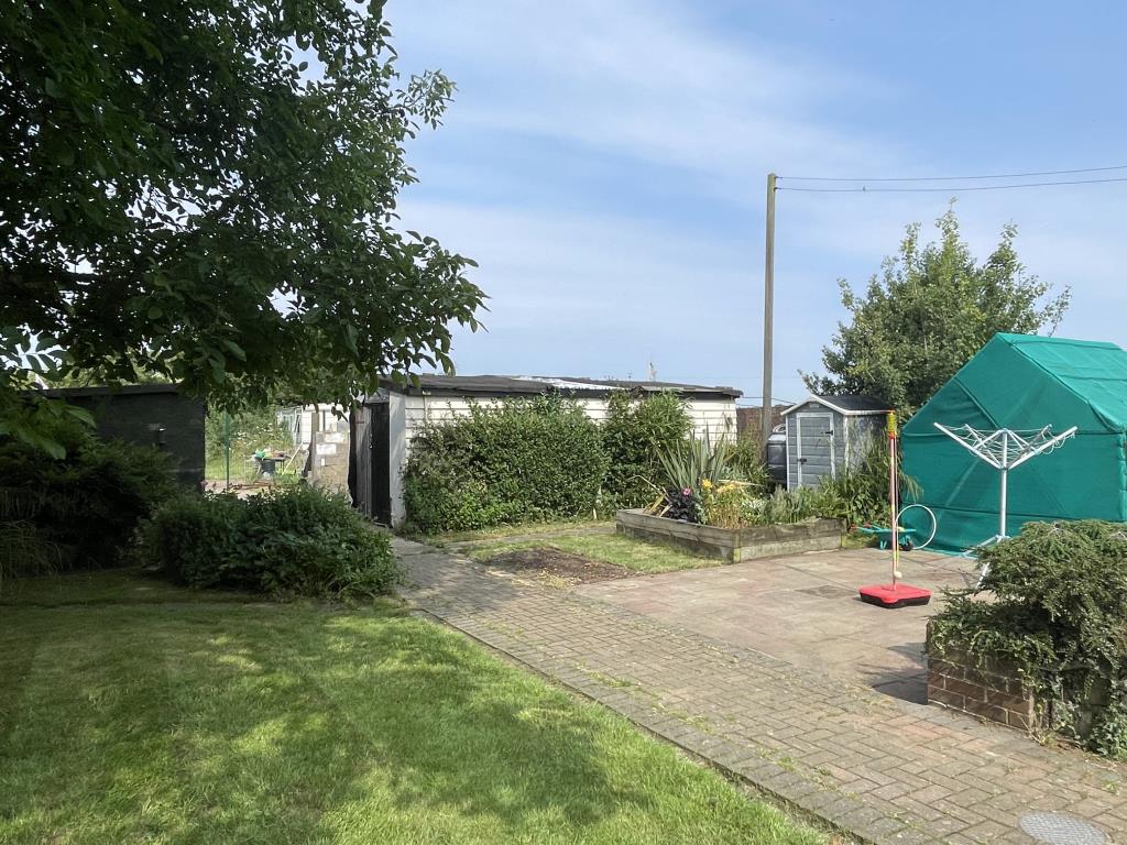 Lot: 108 - A LARGE SEMI-DETACHED HOUSE WITH SELF-CONTAINED ANNEX IN A RURAL SETTING - Rear garden of rural house with annexe